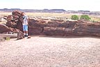 Sandra at big log near visitor center