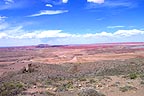 Desert with clouds and distant volcano